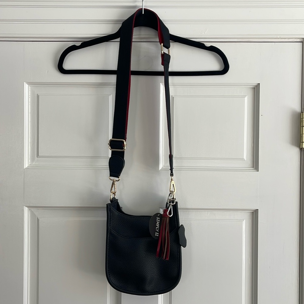 NWT vegan Crossbody black with red and black strap and bonus tassel accessory